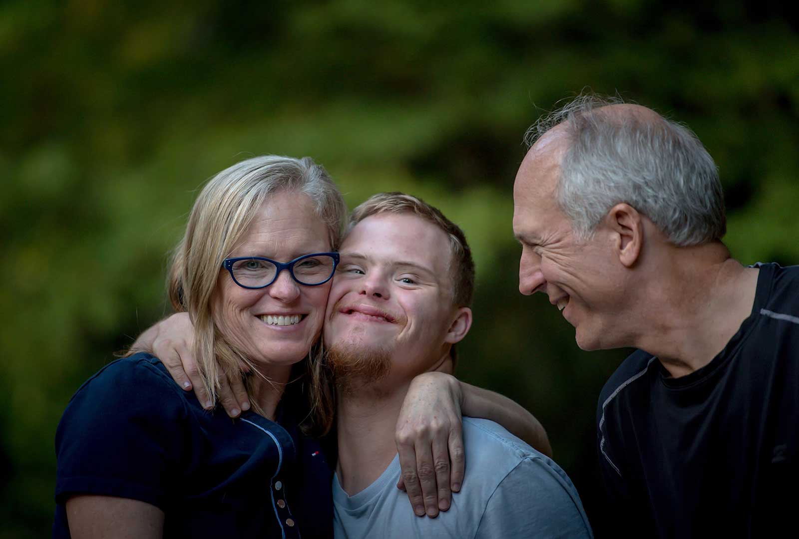 smiling family outside